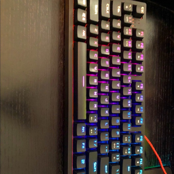Pro gaming keyboard with lighting and spare key cap and key cap puller.